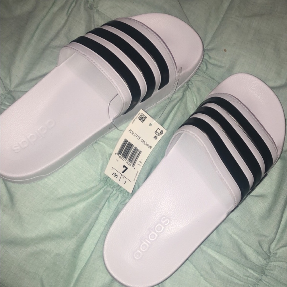 White Adidas adilette shower slides
